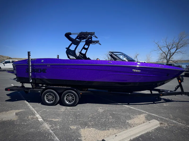 The Image of Purple 2026 Supreme S240 boat on trailer outdoors. - 1