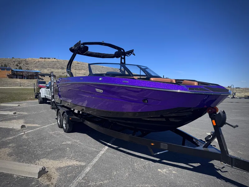 Slide: The Image of Purple 2026 Supreme S240 boat on trailer. - 2