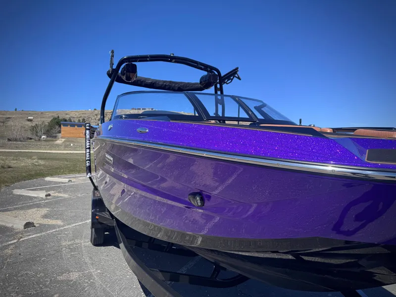 Slide: The Image of Purple Supreme S240 boat, 2026 model, parked outdoors. - 3