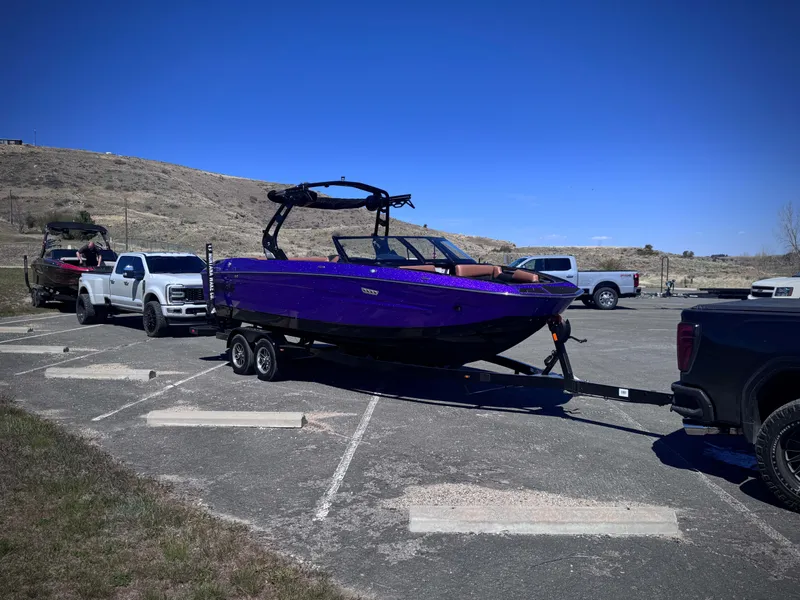 Slide: The Image of Purple Supreme S240 boat on trailer, 2026 model, parked outdoors. - 5