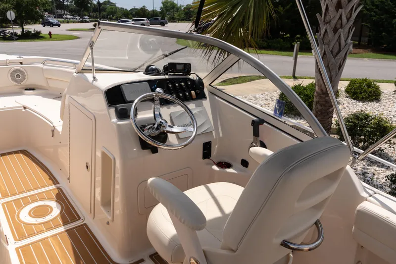Slide: The Image of 2017 Grady-White Freedom 205 boat interior with steering wheel and seating. - 10