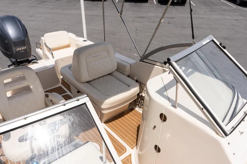 Slide: The Image of 2017 Grady-White Freedom 205 boat interior with seating and Yamaha 200 engine. - 12