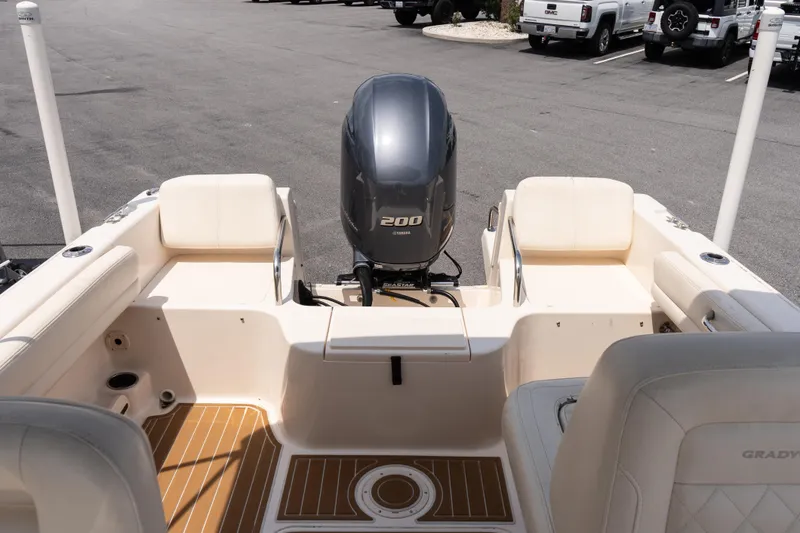 Slide: The Image of 2017 Grady-White Freedom 205 boat interior with Yamaha 200 engine, parked in a lot. - 13