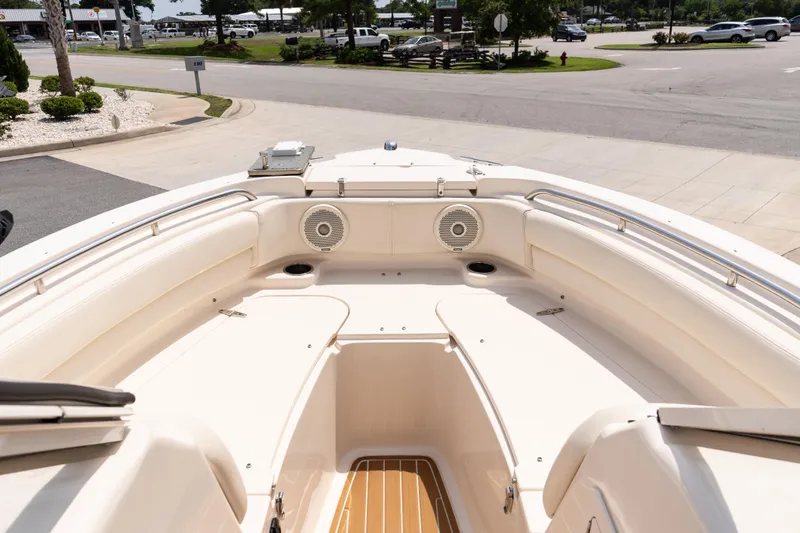 Slide: The Image of 2017 Grady-White Freedom 205 boat interior with seating and speakers. - 14
