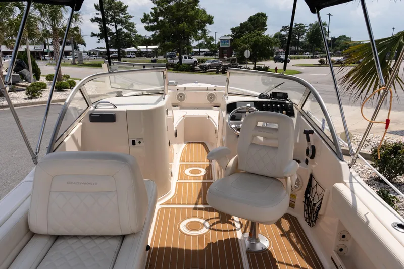 Slide: The Image of 2017 Grady-White Freedom 205 boat interior with seating and steering console. - 9