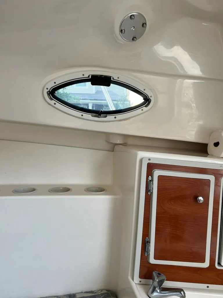 Slide: The Image of Interior of a 2008 Polar 2300 WA boat with window and cabinet. - 12
