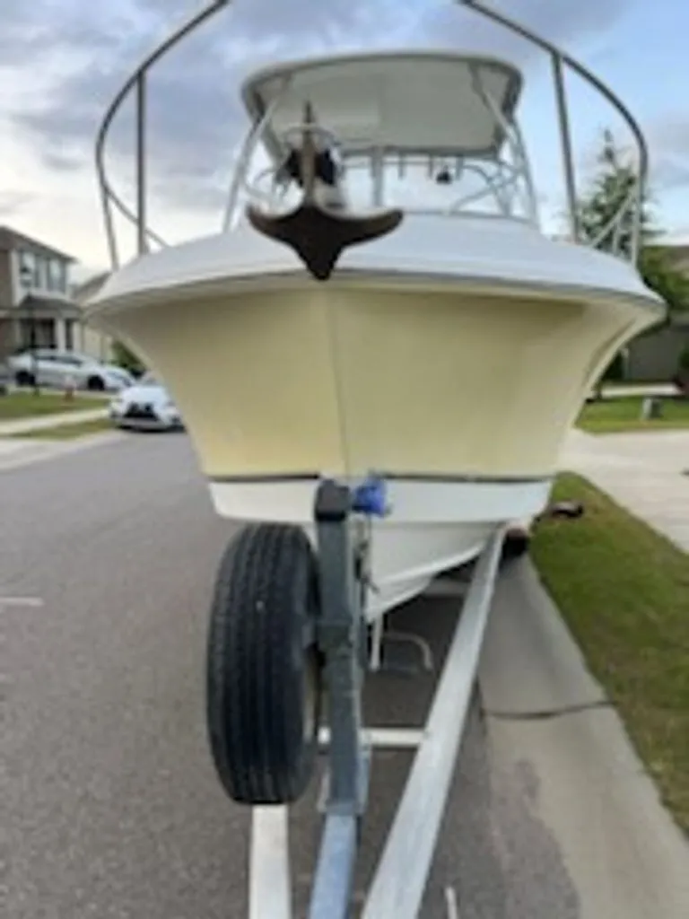 Slide: The Image of 2008 Polar 2300 WA boat on trailer in residential area. - 2
