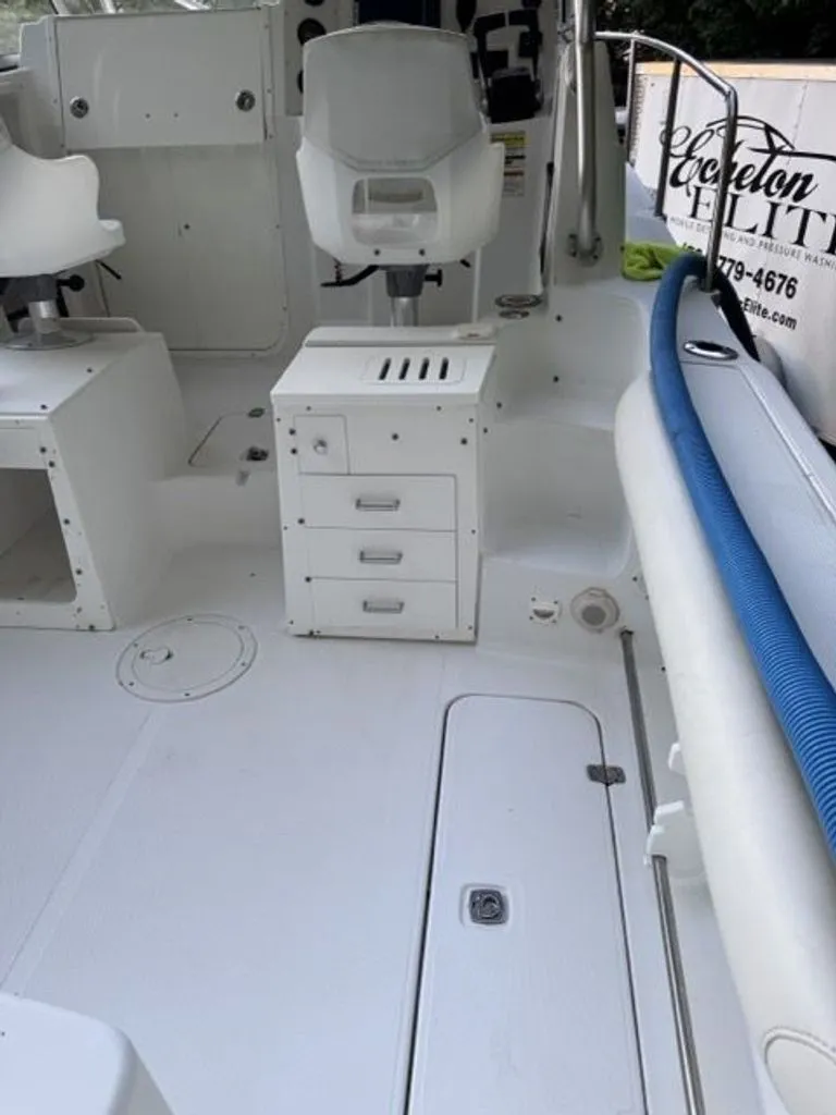 Slide: The Image of Interior of a 2008 Polar 2300 WA boat with white seating. - 4