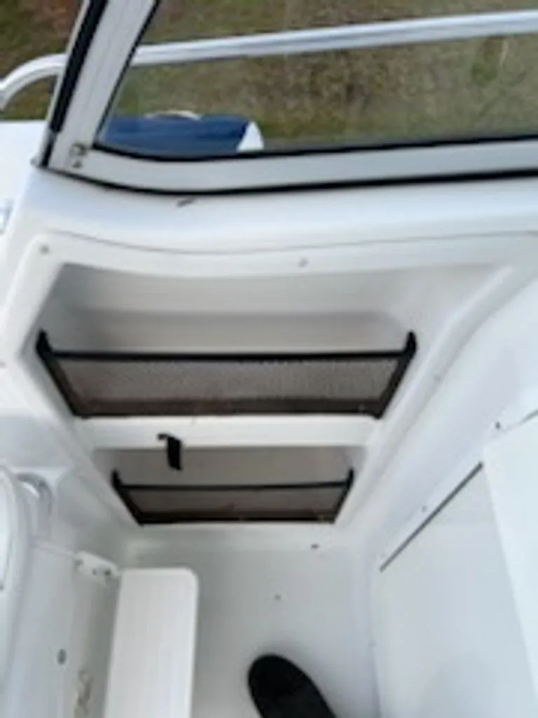 Slide: The Image of Interior of a 2008 Polar 2300 WA boat with storage compartments. - 9