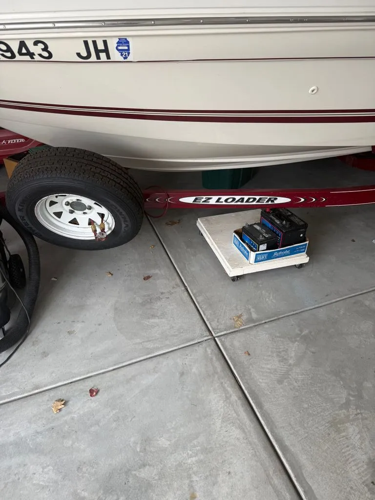The Image of 2009 Sea Ray 185 Sport on EZ Loader trailer in storage. - 0
