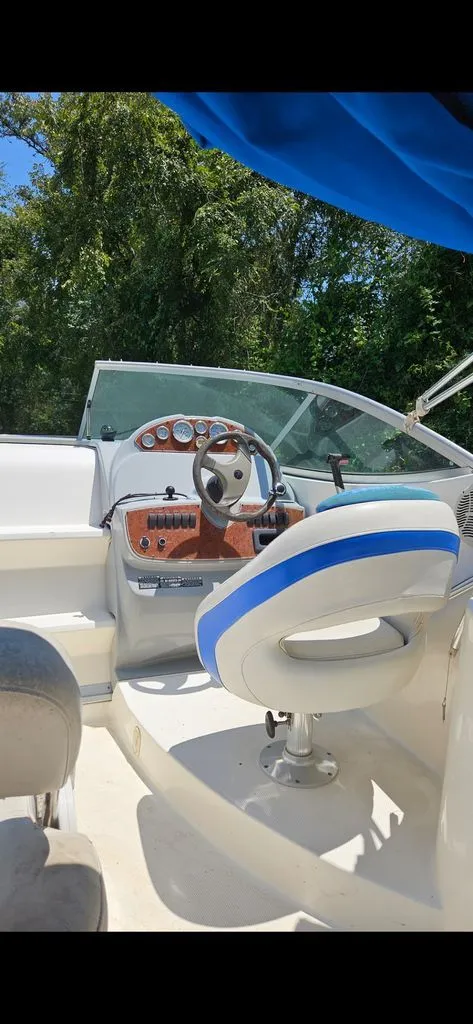 Slide: The Image of Interior of a 2006 Bayliner 265 boat with helm station. - 1