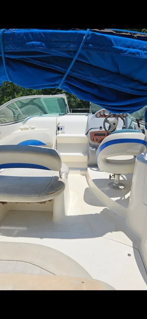 Slide: The Image of Interior of a 2006 Bayliner 265 with blue cover. - 2