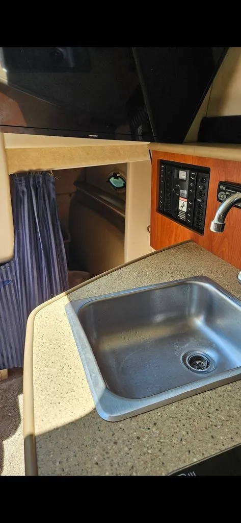Slide: The Image of Interior of 2006 Bayliner 265 with sink and control panel. - 4