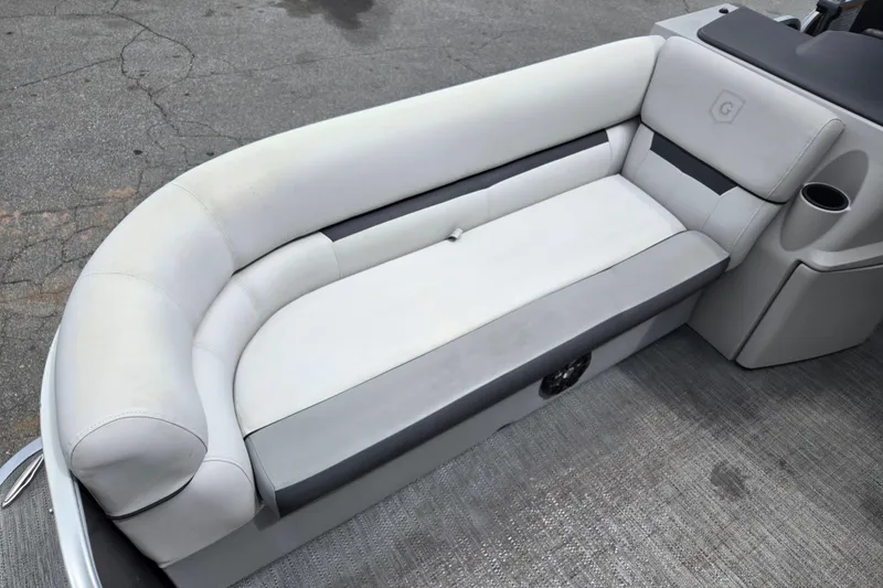 Slide: The Image of 2023 Godfrey Sweetwater 2286 C boat seating with cup holder and speaker. - 11