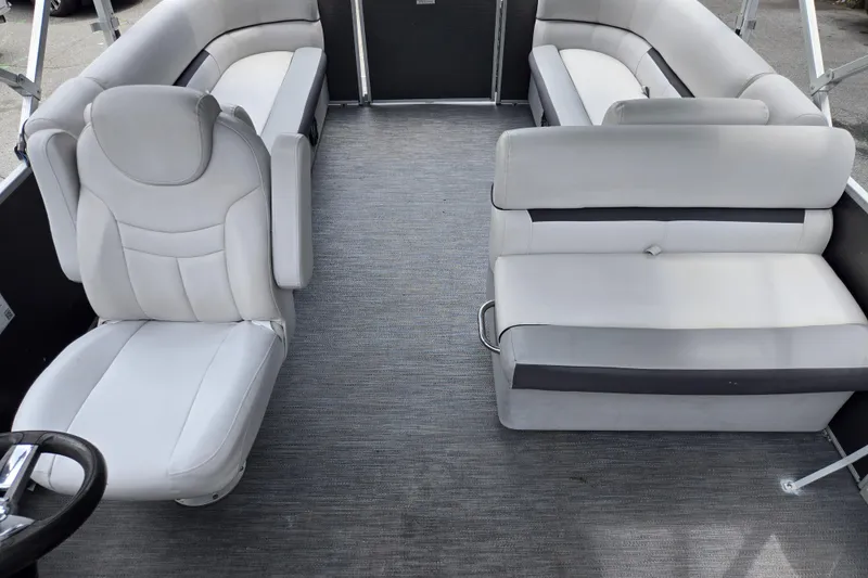 Slide: The Image of 2023 Godfrey Sweetwater 2286 C pontoon boat interior with plush seating and modern design. - 12