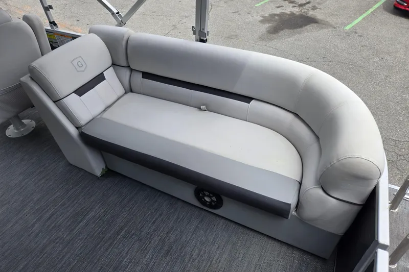 Slide: The Image of Luxurious seating on 2023 Godfrey Sweetwater 2286 C pontoon boat, featuring plush gray upholstery. - 14