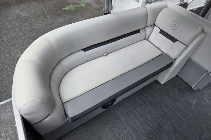 Slide: The Image of 2023 Godfrey Sweetwater 2286 C boat interior with plush gray seating. - 15