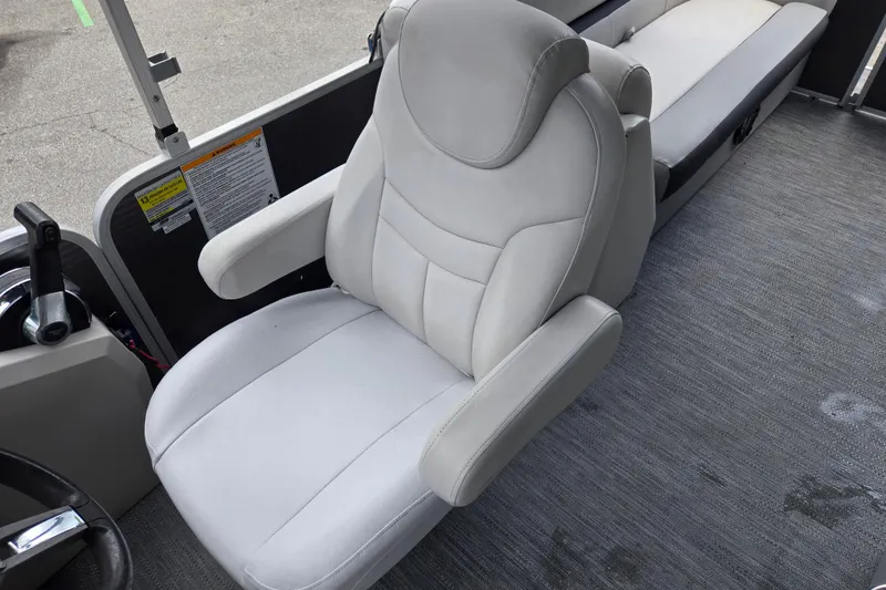 Slide: The Image of Captain's chair on 2023 Godfrey Sweetwater 2286 C pontoon boat, featuring plush upholstery. - 17
