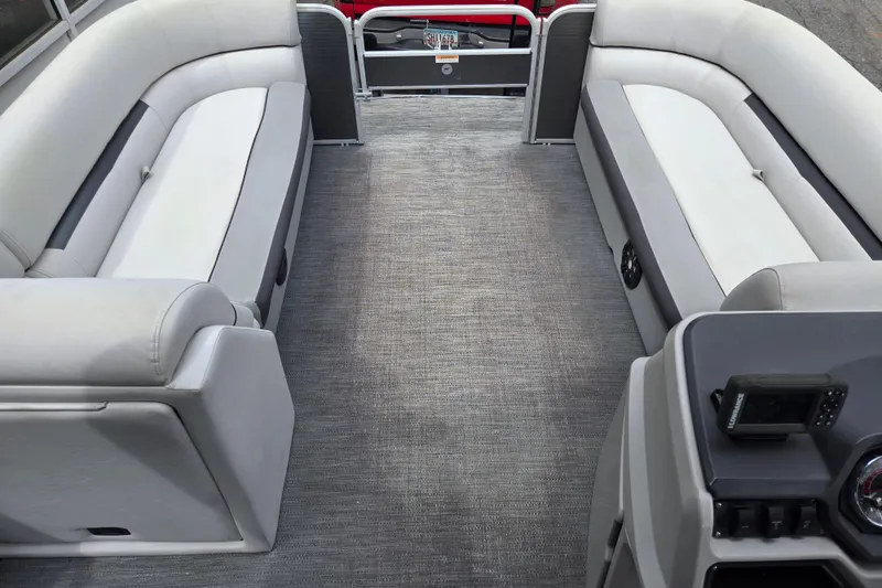 Slide: The Image of Interior of 2023 Godfrey Sweetwater 2286 C pontoon boat with gray seating and carpet. - 9
