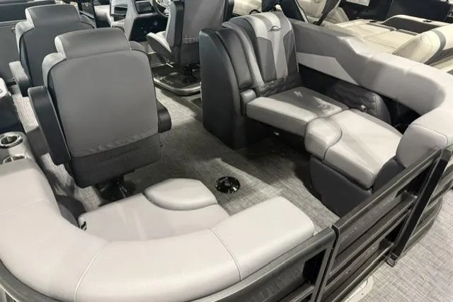 Slide: The Image of Luxurious interior of 2026 SunCatcher Elite 322SR pontoon boat with plush seating. - 6