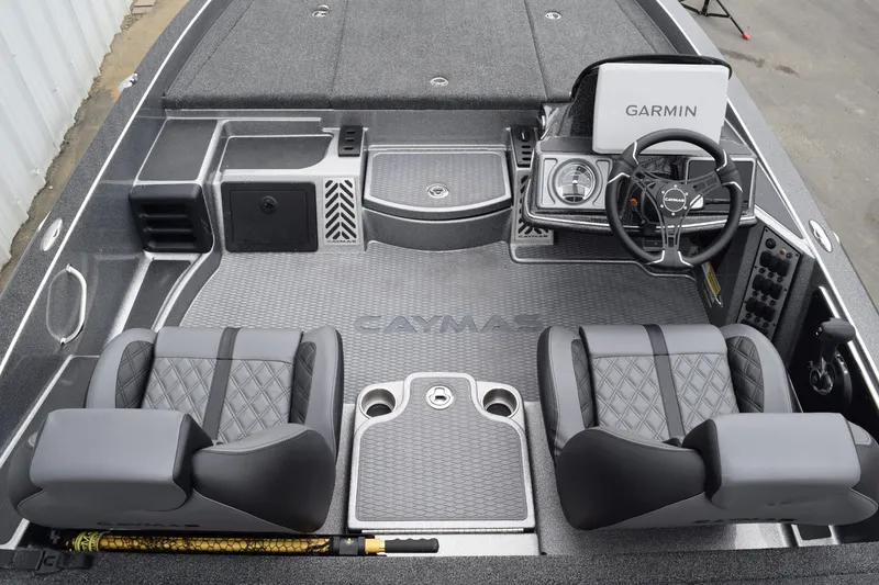 Slide: The Image of 2027 Caymas 201 Pro boat interior with Garmin system and dual seats. - 17