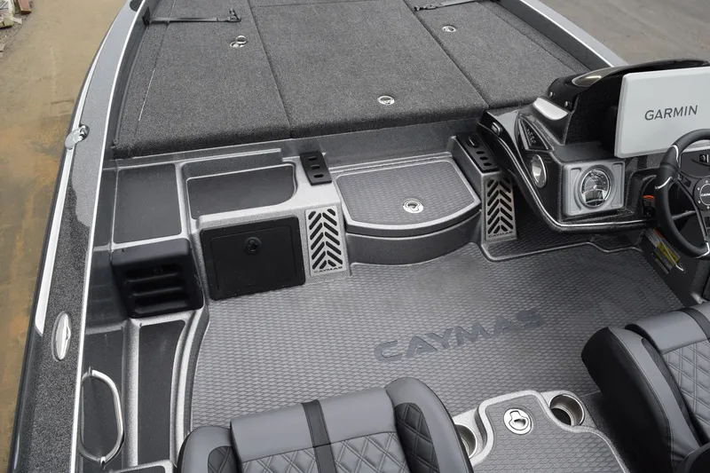 Slide: The Image of 2027 Caymas 201 Pro boat interior with Garmin system and sleek seating. - 19