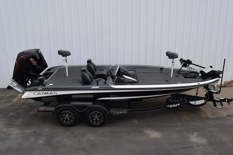 Slide: The Image of 2027 Caymas 201 Pro fishing boat on trailer, side view. - 2