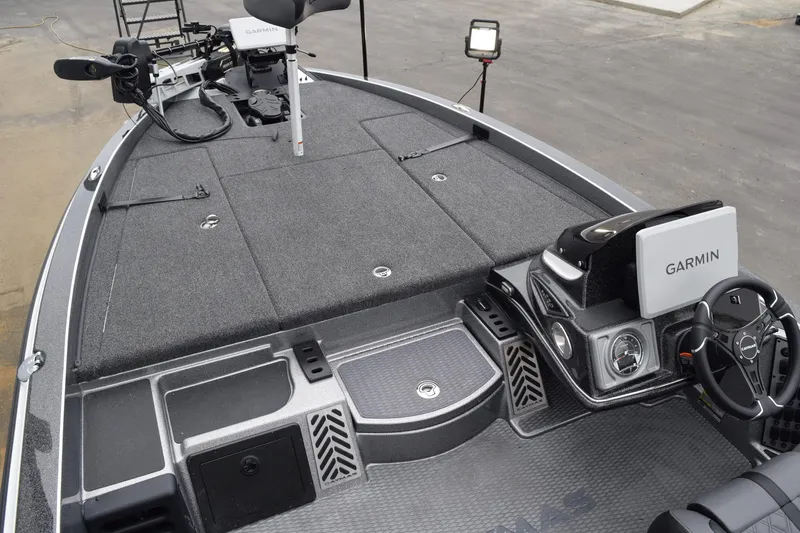 Slide: The Image of 2027 Caymas 201 Pro boat interior with Garmin electronics and spacious deck. - 20