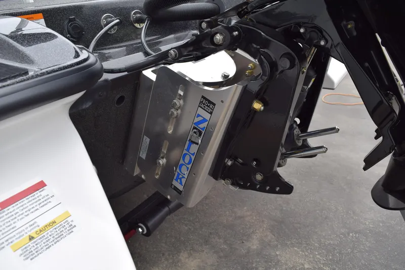 Slide: The Image of 2027 Caymas 201 Pro boat engine mount detail with hydraulic jack plate. - 27