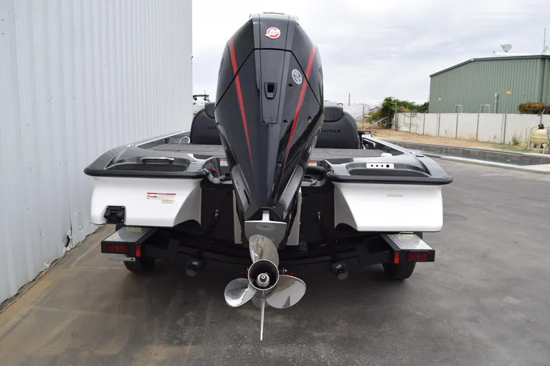 Slide: The Image of Rear view of 2027 Caymas 201 Pro boat with powerful outboard motor. - 29