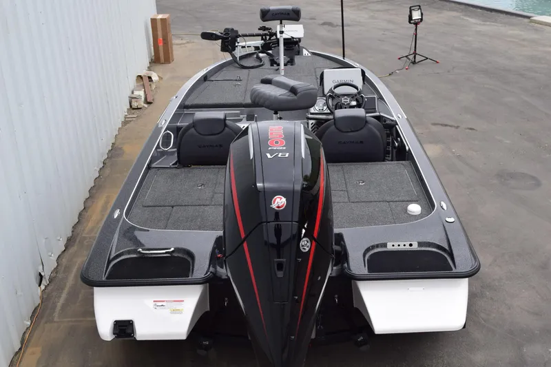Slide: The Image of 2027 Caymas 201 Pro boat with powerful engine, sleek design, and advanced navigation equipment. - 30