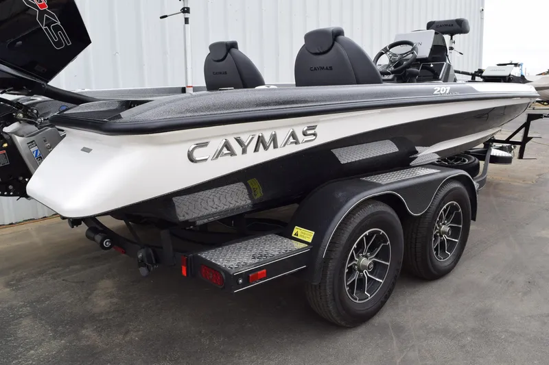 Slide: The Image of 2027 Caymas 201 Pro boat on trailer, featuring sleek design and dual seats. - 4