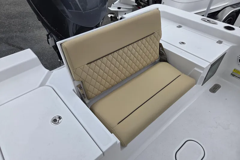 Slide: The Image of 2026 Sportsman Masters 227 Bay Boat with beige diamond-stitched seating and white deck. - 11