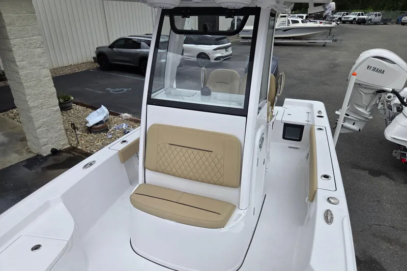 Slide: The Image of 2026 Sportsman Masters 227 Bay Boat with tan seating and Yamaha outboard motor. - 15