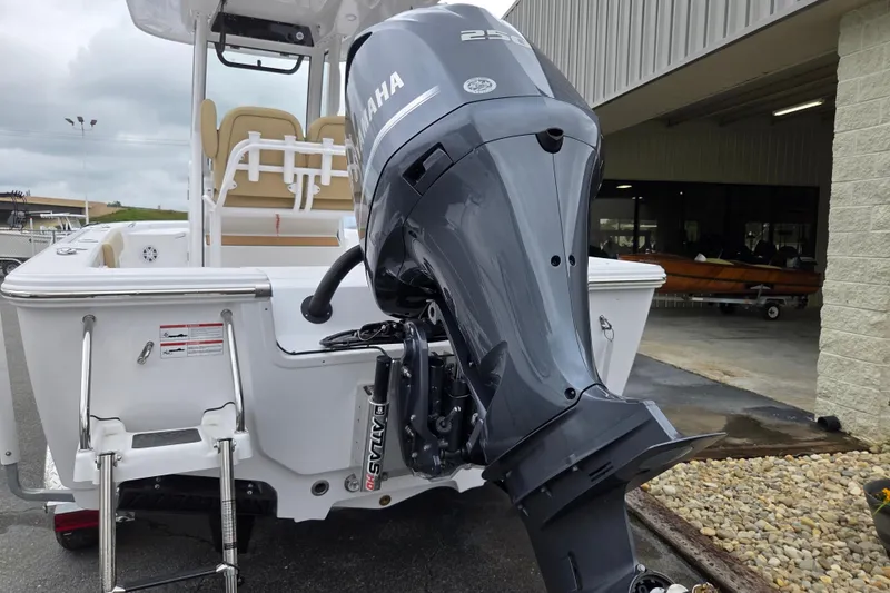 Slide: The Image of 2026 Sportsman Masters 227 Bay Boat with Yamaha outboard motor, parked outdoors. - 6