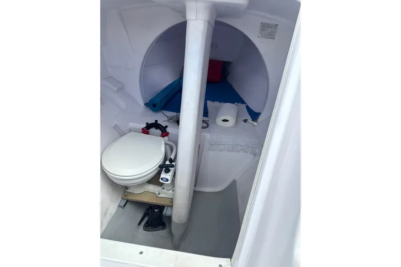 Slide: The Image of Compact marine toilet inside Corsair 760R sailboat, 2019 model, with essential amenities. - 3