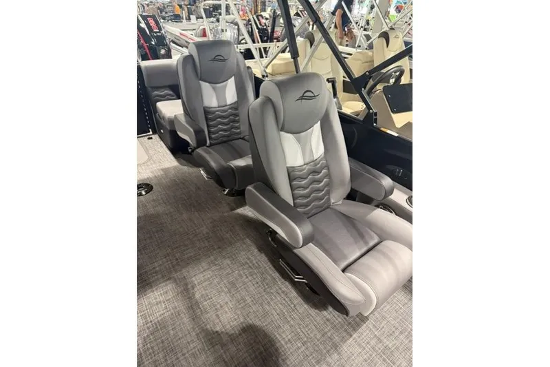 Slide: The Image of Luxurious seating in 2026 SunCatcher Elite 322SR boat, featuring sleek gray upholstery. - 6