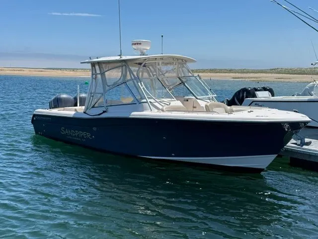The Image of 2013 Grady-White Freedom 285 boat on calm water. - 0