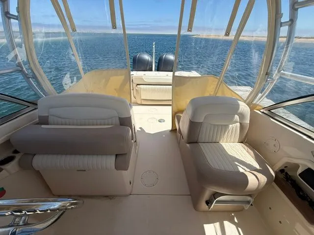 Slide: The Image of Interior view of a 2013 Grady-White Freedom 285 boat on the water. - 11