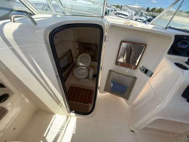 Slide: The Image of Interior view of 2013 Grady-White Freedom 285 featuring a toilet. - 13
