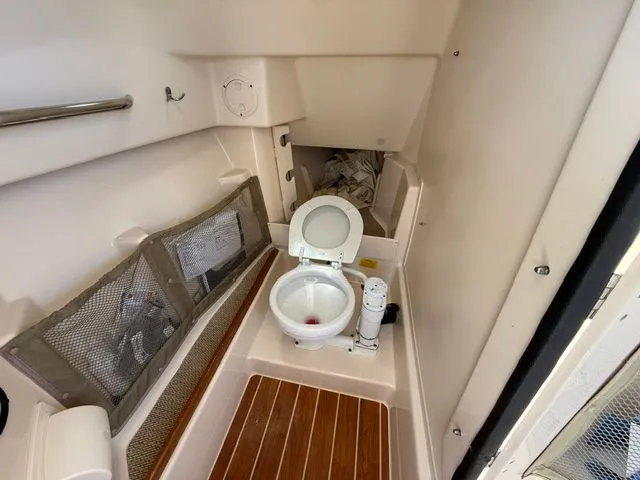 Slide: The Image of Interior of a 2013 Grady-White Freedom 285 with toilet. - 14