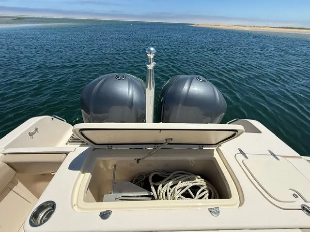 Slide: The Image of 2013 Grady-White Freedom 285 boat with open storage and engines. - 17