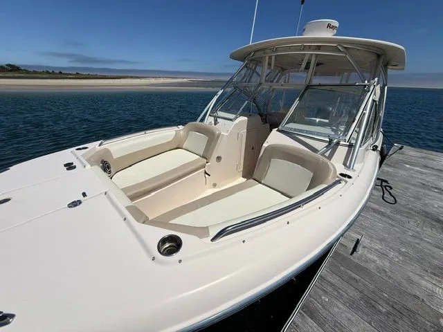 Slide: The Image of 2013 Grady-White Freedom 285 boat docked with open deck. - 3