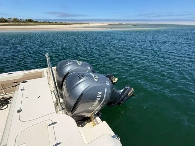 Slide: The Image of Grady-White Freedom 285 boat with Yamaha engines on calm water, 2013 model. - 4