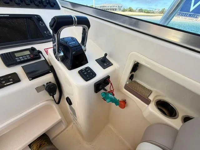 Slide: The Image of Control console of a 2013 Grady-White Freedom 285 boat. - 8