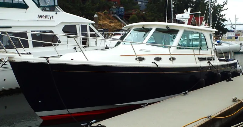 The Image of 2017 Back Cove 37 yacht docked, sleek design. - 0