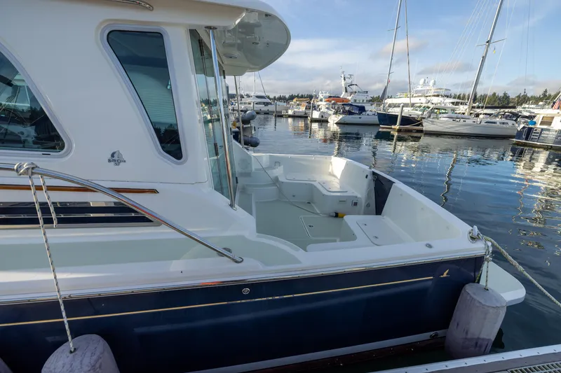 Slide: The Image of 2017 Back Cove 37 boat docked at marina. - 11