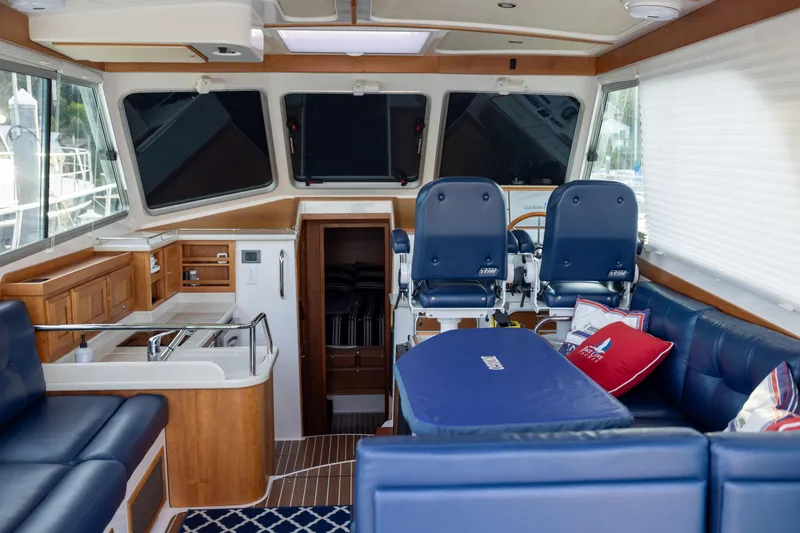 Slide: The Image of Interior of a 2017 Back Cove 37 yacht with blue seating. - 21