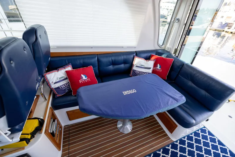 Slide: The Image of Interior of a 2017 Back Cove 37 yacht with blue seating. - 22