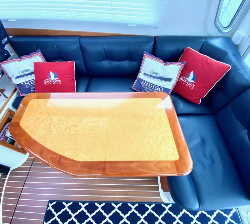 Slide: The Image of Interior of a 2017 Back Cove 37 yacht with elegant seating area. - 24